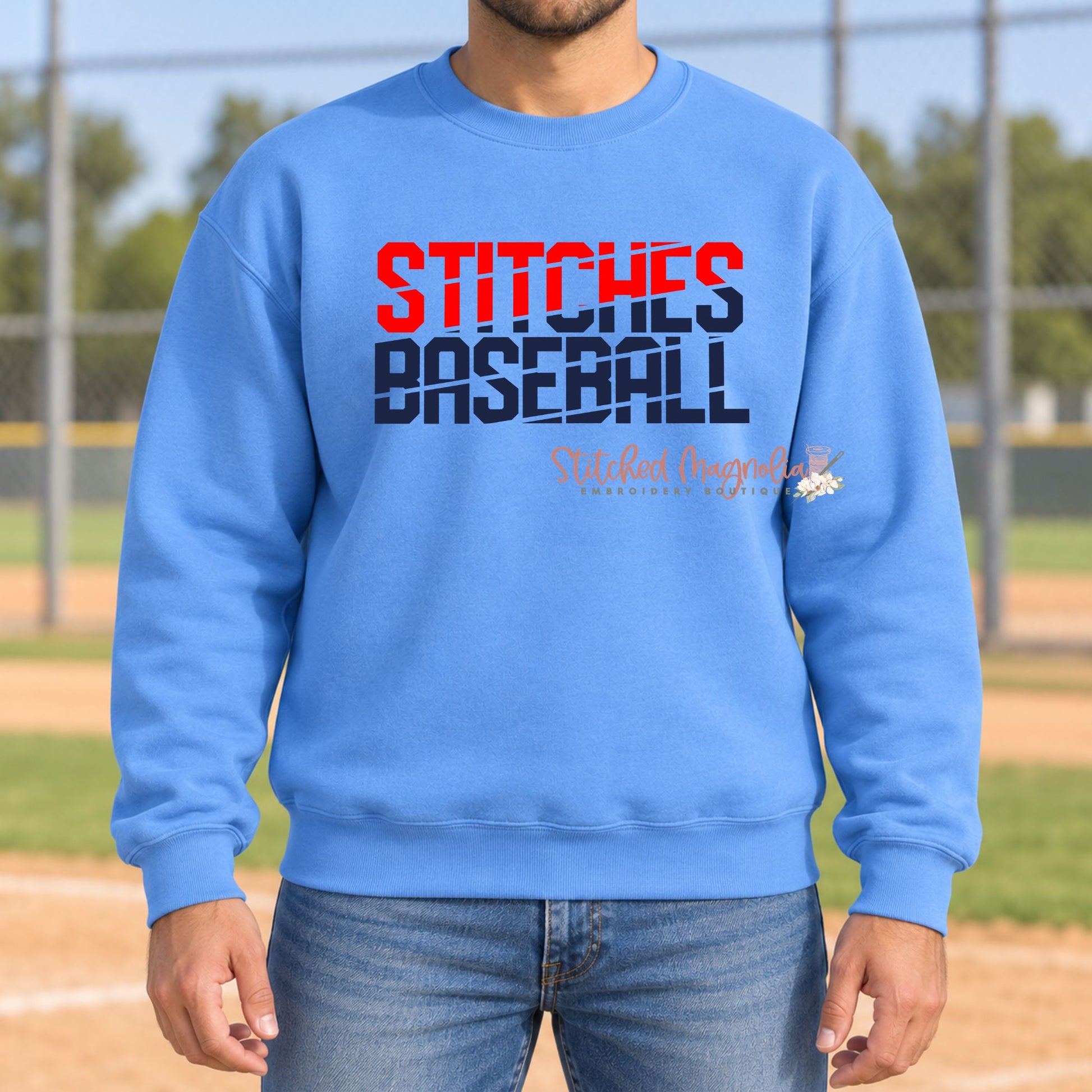 Blue Stitches Baseball crewneck sweatshirt with stacked red and navy slash lettering.