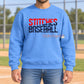 Blue Stitches Baseball crewneck sweatshirt with stacked red and navy slash lettering.