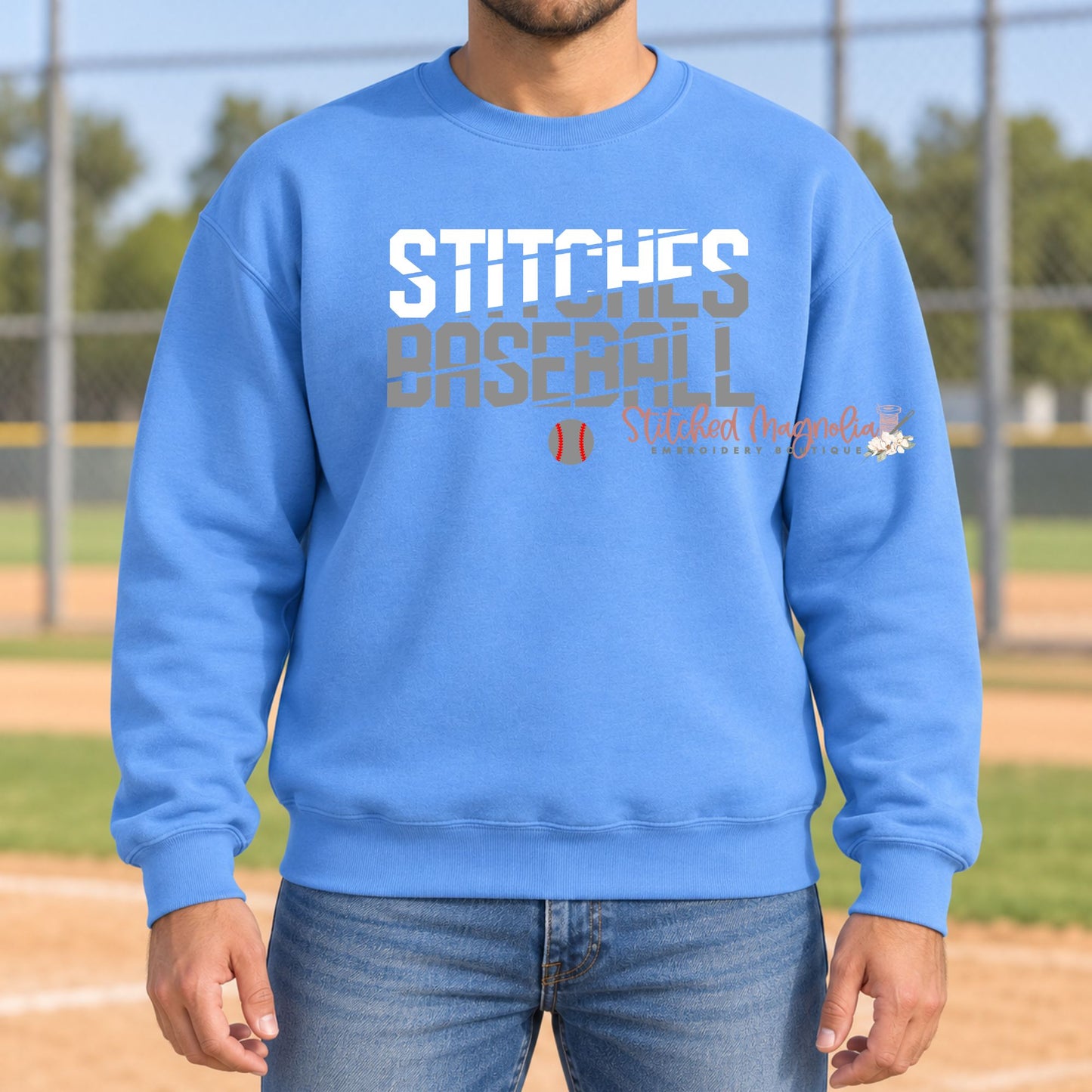 Blue Stitches Baseball crewneck sweatshirt with white and gray slash lettering and a small baseball graphic.