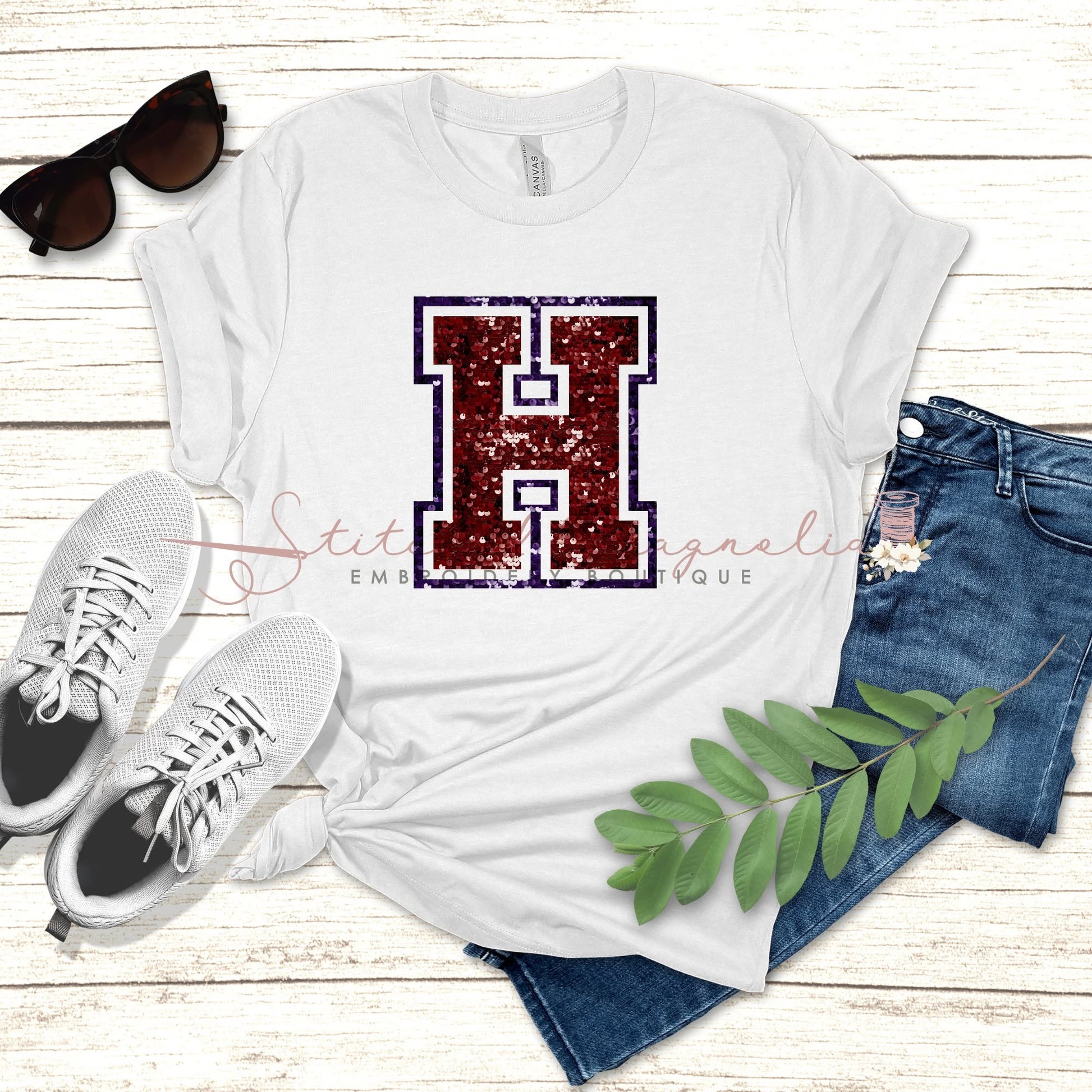 Hannan Hawks Faux Sequin H Lettermark Tee - maroon glitter H on white Bella Canvas tee