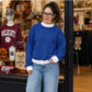 Model wearing green and white contrast mock neck sweatshirt