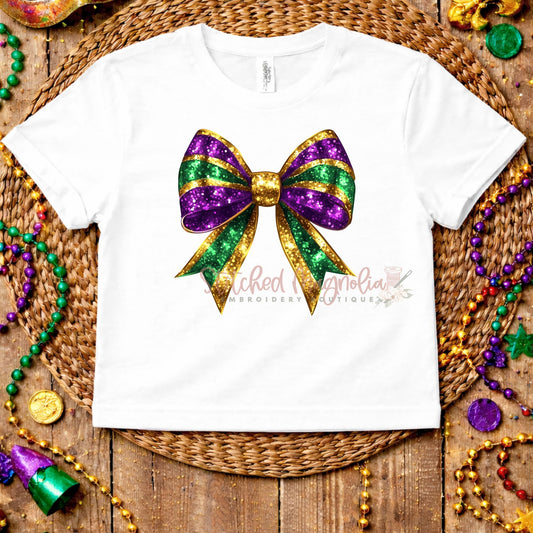 Mardi Gras Glitter Bow Tee | Sparkly Purple Green Gold Bow Design | Festive Mardi Gras Shirt